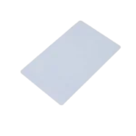 Blank white plastic CR80 credit-card-sized proximity card alongside a ring of colorful plastic key fobs, demonstrating standard 13.56MHz contactless components.