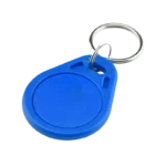 A compact blue 13.56MHz RFID IC key tag featuring a teardrop-shaped waterproof ABS plastic casing and a metal key ring attachment.