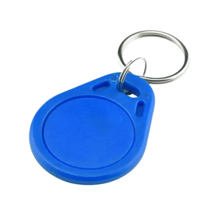A compact blue 13.56MHz RFID IC key tag featuring a teardrop-shaped waterproof ABS plastic casing and a metal key ring attachment.