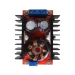 Industrial-grade power regulator PCB showing terminal blocks labeled for input and output, alongside dense parallel black anodized heat dissipation fins.