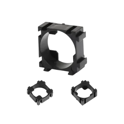 18650 1S black plastic battery modular interlocking spacer bracket showing its circular inner sleeve and multi-sided dovetail joints.