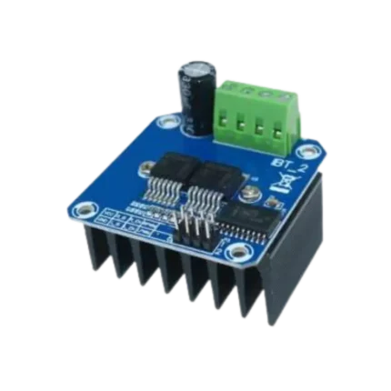 High-power blue HW-039 motor driver board showing a massive black aluminum cooling fins block fixed underneath, an integrated 4-position green terminal block alongside an electro-filtering capacitor, two prominent central half-bridge ICs, and an 8-pin control connector logic bank.