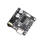 Ultra-miniature red VHM-314 Bluetooth audio receiver board displaying its surface-mount Type-C power input port, a gold-plated 3.5mm AUX headphone jack, an onboard Bluetooth chip with printed antenna trace, an indicator LED, and dedicated power/audio soldering pads.