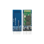 Rectangular blue HC-05 Bluetooth transceiver board showing a green RF module layer with a gold serpentine antenna track on its tip, a small surface-mount status LED, an integrated micro-pushbutton near its top corner, and a 6-pin straight male connection terminal bank pointing downward.