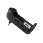 HD-0688 single-slot 18650 lithium battery charger showing its compact black housing, spring-loaded negative slot, and integrated status LED indicator.