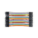 A flat 40-pin multi-colored male-to-male Dupont ribbon jumper cable layout displaying 10cm strands and a row of black square plastic connector heads with extended silver pins on both ends.