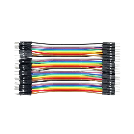 A flat 40-pin multi-colored male-to-male Dupont ribbon jumper cable layout displaying 10cm strands and a row of black square plastic connector heads with extended silver pins on both ends.
