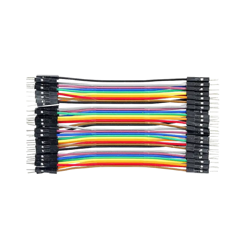 Male to Male Dupont Jumper Wires 10cm A flat 40-pin multi-colored male-to-male Dupont ribbon jumper cable layout displaying 10cm strands and a row of black square plastic connector heads with extended silver pins on both ends.