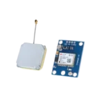 Rectangular blue NEO-6M GPS module showing a central silver metal shielded u-blox chip, a circular rechargeable coin-cell backup battery, a tiny micro-coaxial antenna jack, and a separate square tan-and-white ceramic patch antenna element linked via a flexible grey lead wire.